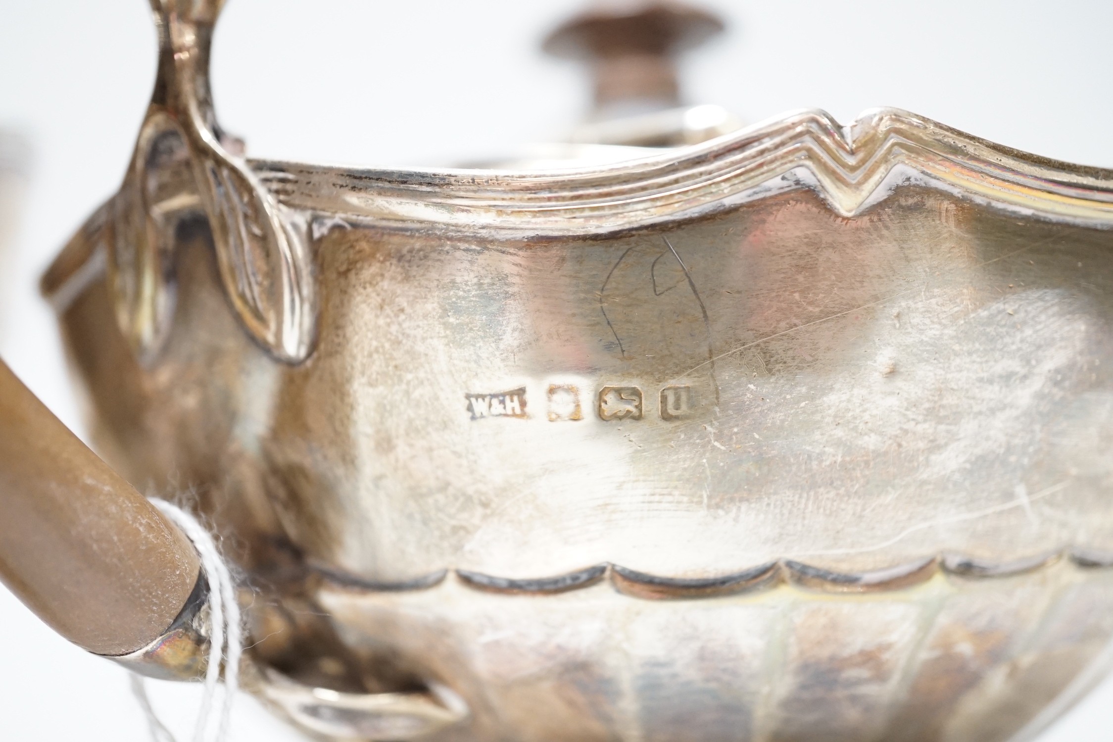 A George V silver tea kettle and teapot by Walker & Hall, Birmingham, 1919 & 1922, kettle height 20.5cm, 30.6oz.
